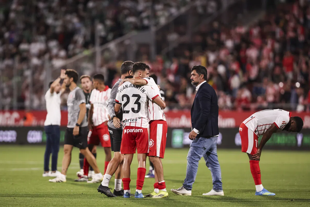 Girona players reacting to relegation after a match