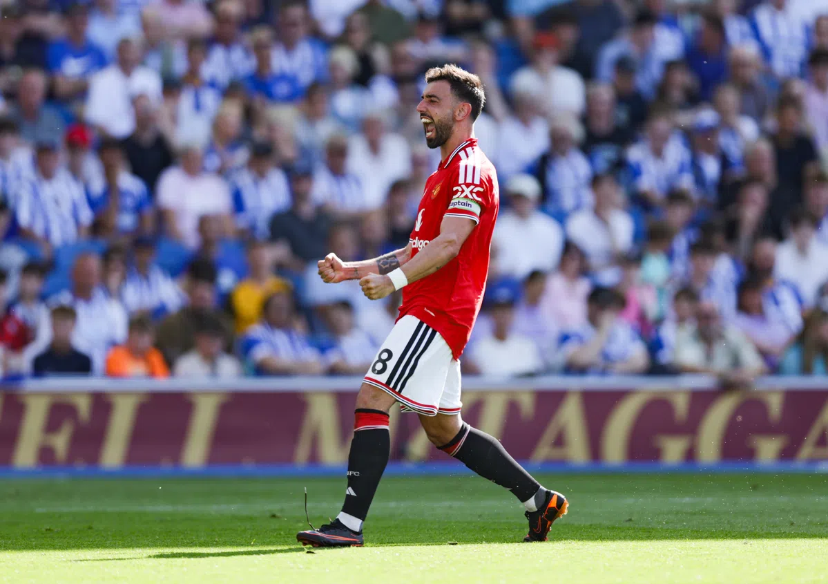 Manchester United captain Bruno Fernandes dribbles the ball during a Premier League match.