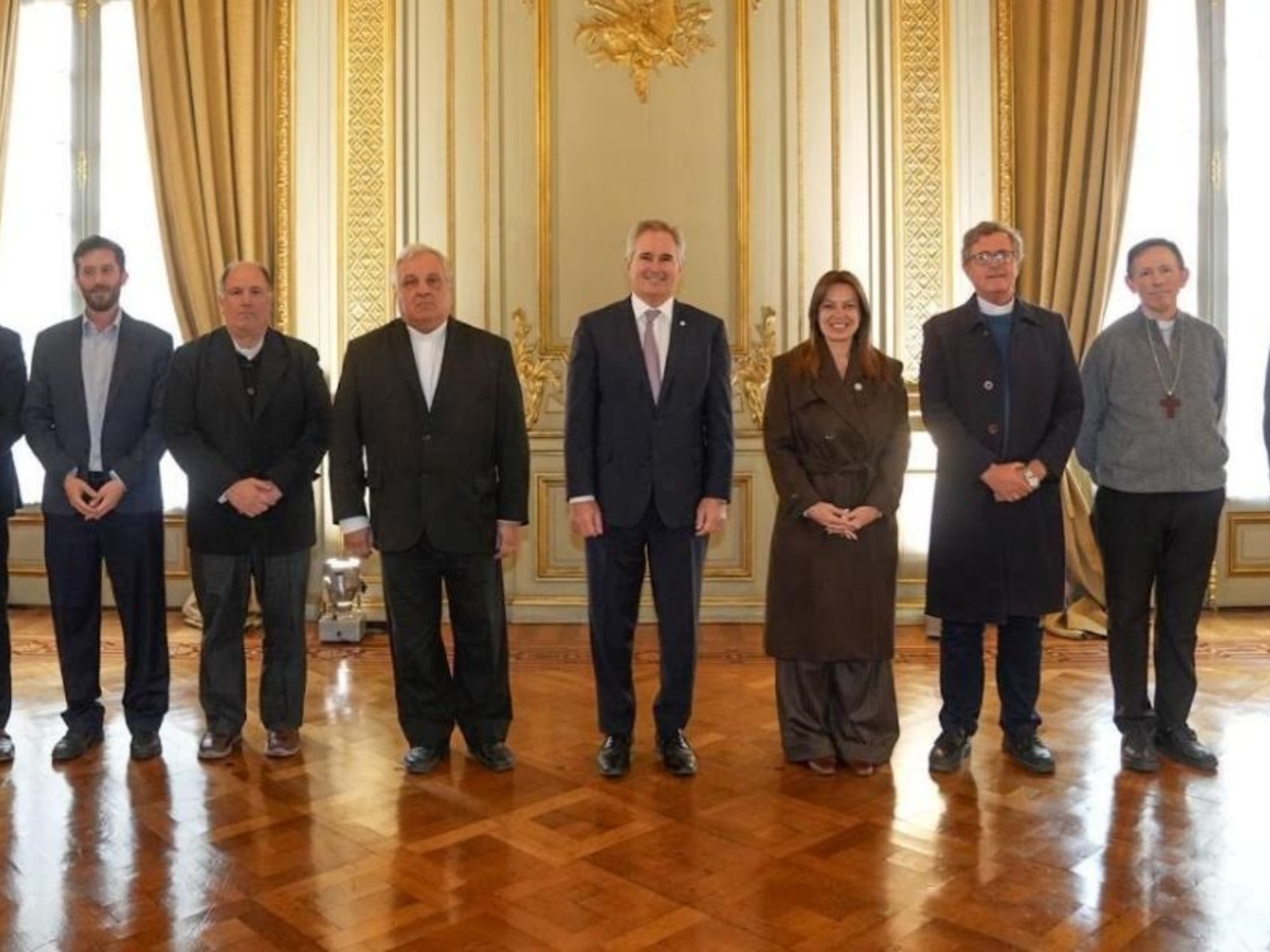 Government officials and Catholic bishops in a meeting at the Chancellery