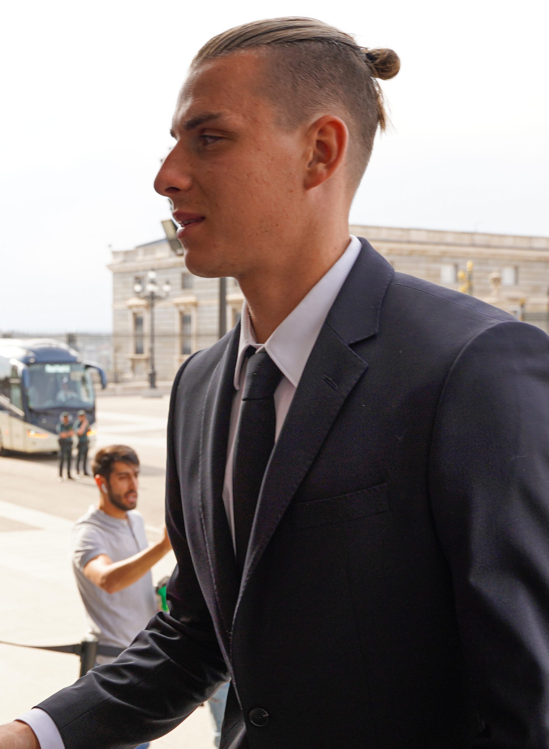 Andriy Lunin, goalkeeper for Real Madrid, greeting companions of teammates.