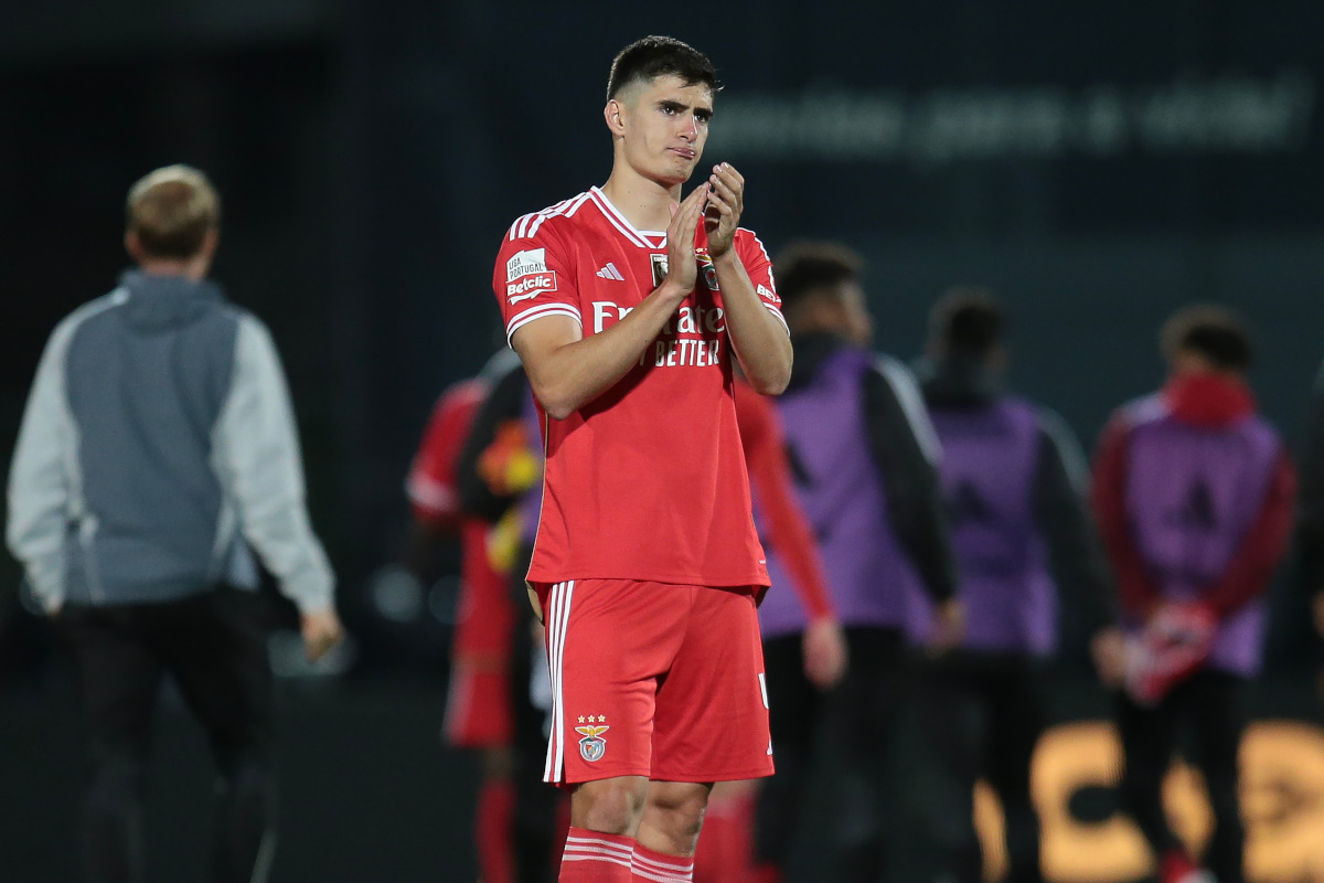 Benfica defender Antonio Silva applauds fans after a match.