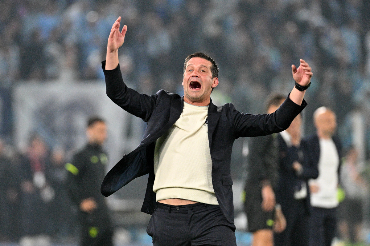 Cristian Chivu celebrating with the Coppa Italia trophy after Inter Milan's victory against Lazio at Stadio Olimpico.
