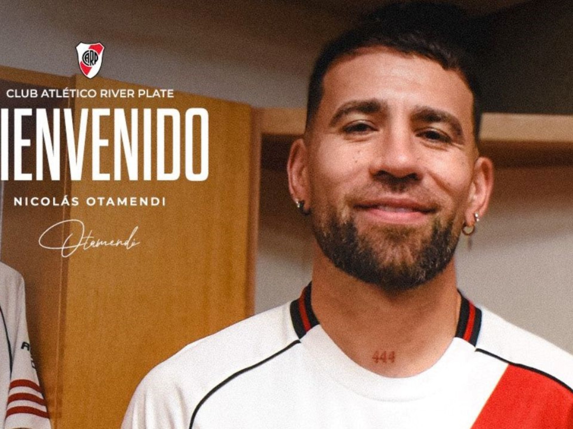 Nicolás Otamendi in a River Plate training kit, smiling.