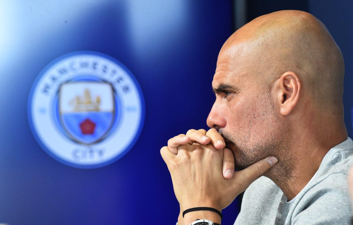 Pep Guardiola overseeing a Manchester City training session