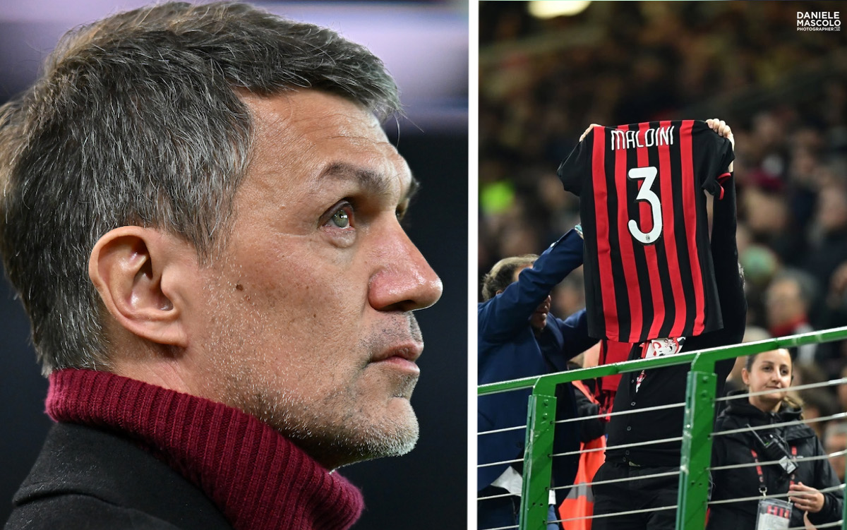 AC Milan fan holding a Paolo Maldini jersey in the stands during a match