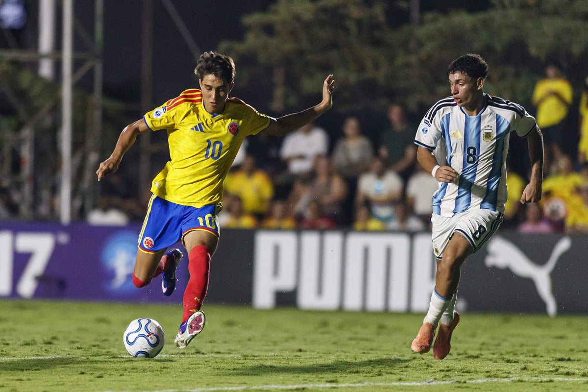 Samuel Martinez in action on a football pitch, showcasing his skills.