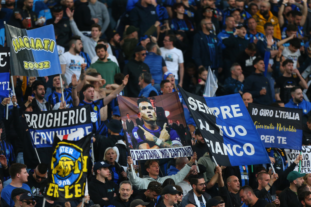 Inter Milan fans holding a banner at Stadio Olimpico before a match