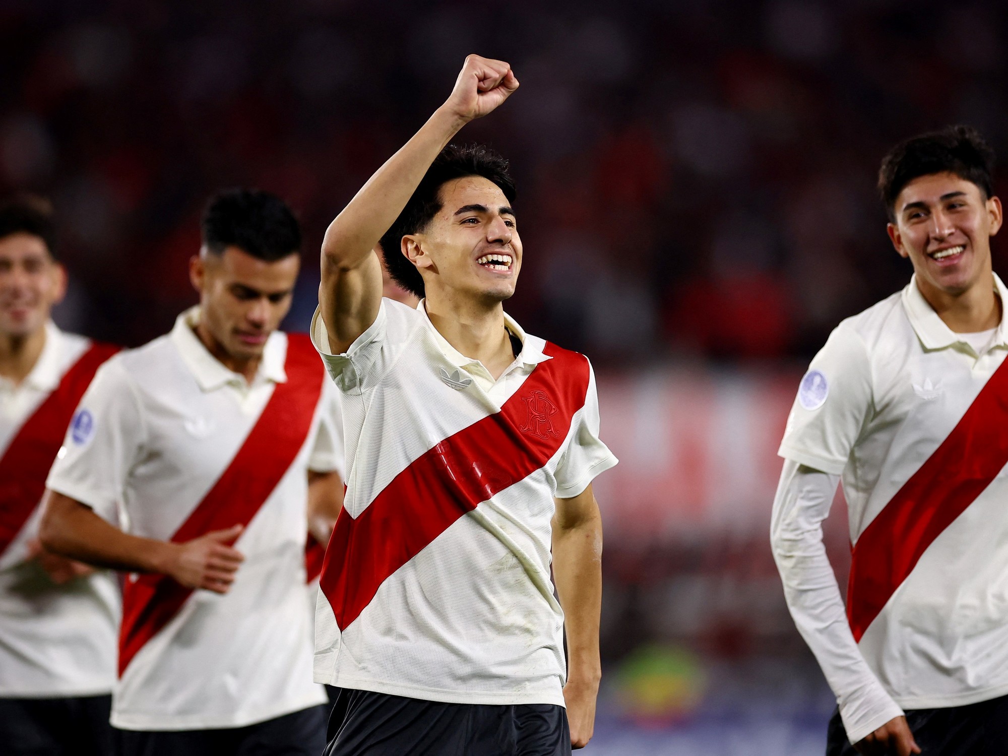 River Plate players celebrating a goal on the field.