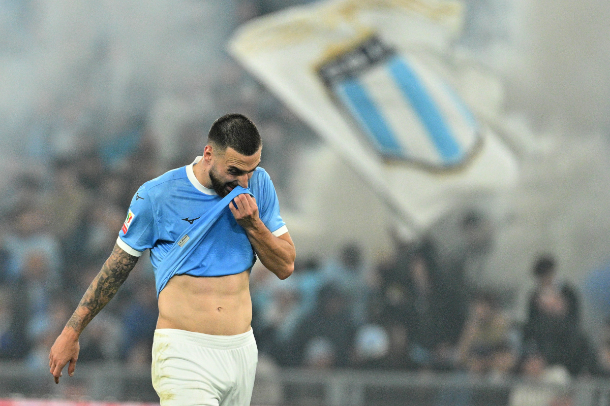 Lazio coach Maurizio Sarri gestures from the dugout during a Serie A match
