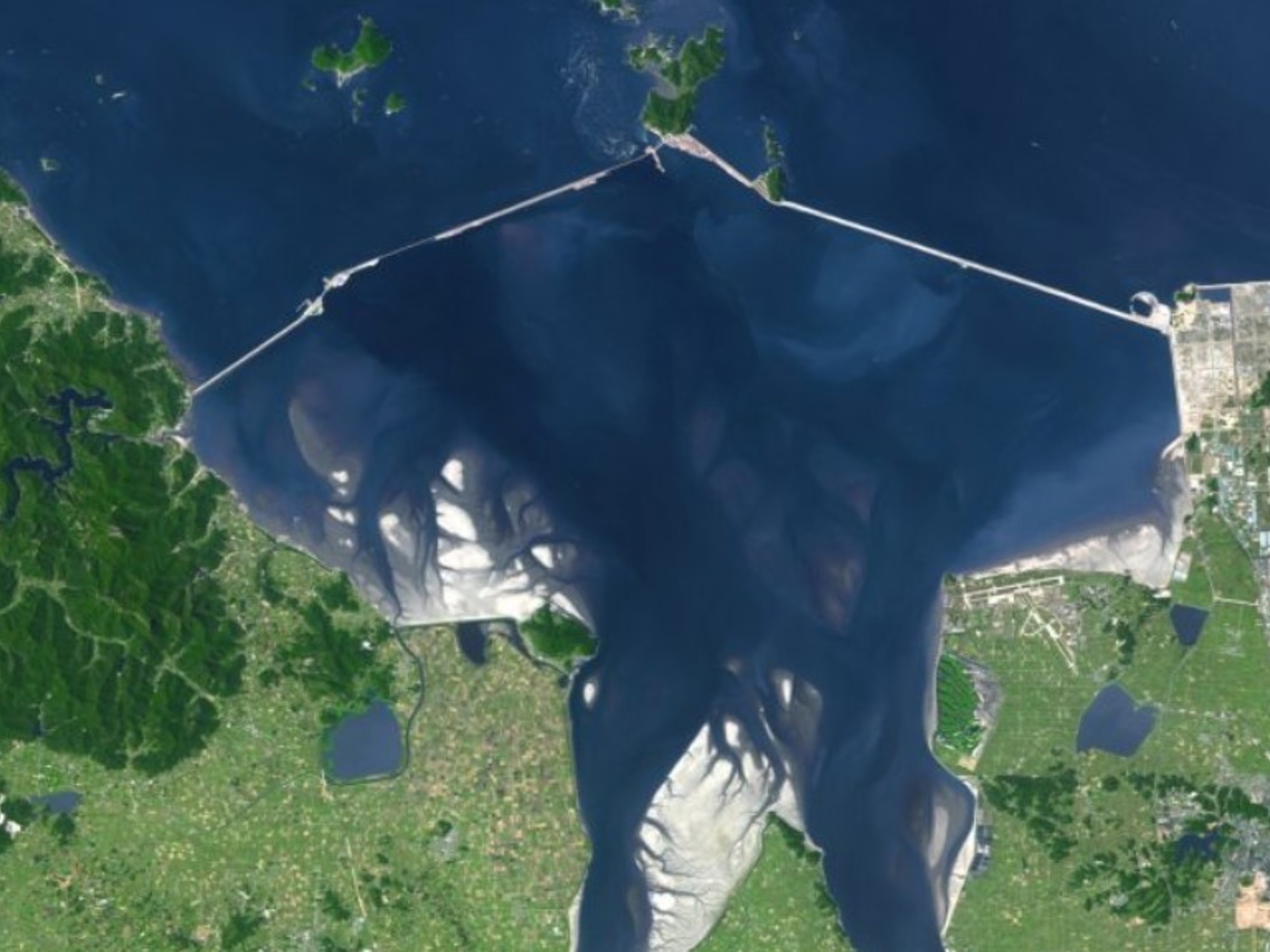 Aerial view of the Saemangeum Seawall stretching across the sea in South Korea