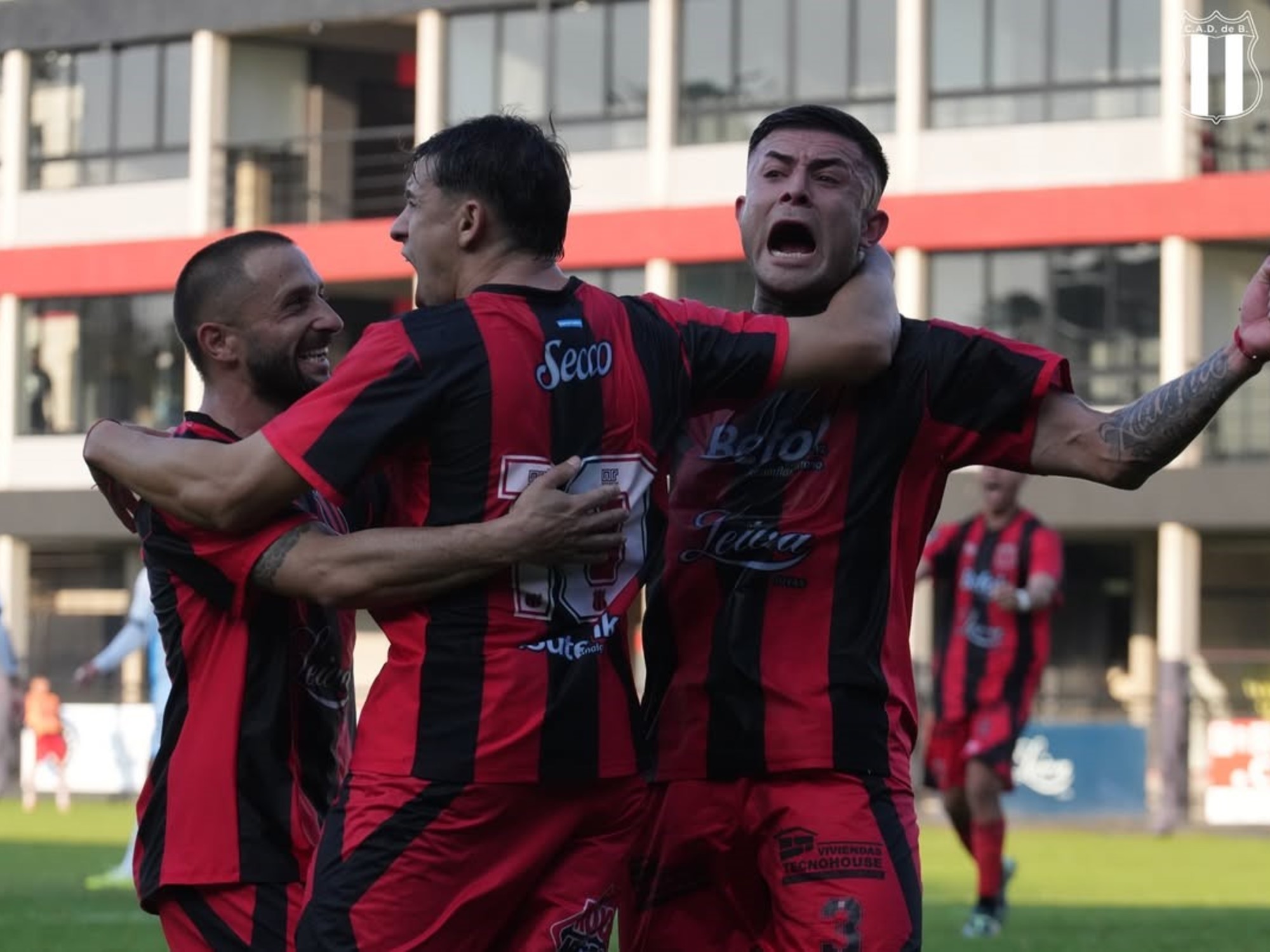 Defensores de Belgrano players celebrating a goal.
