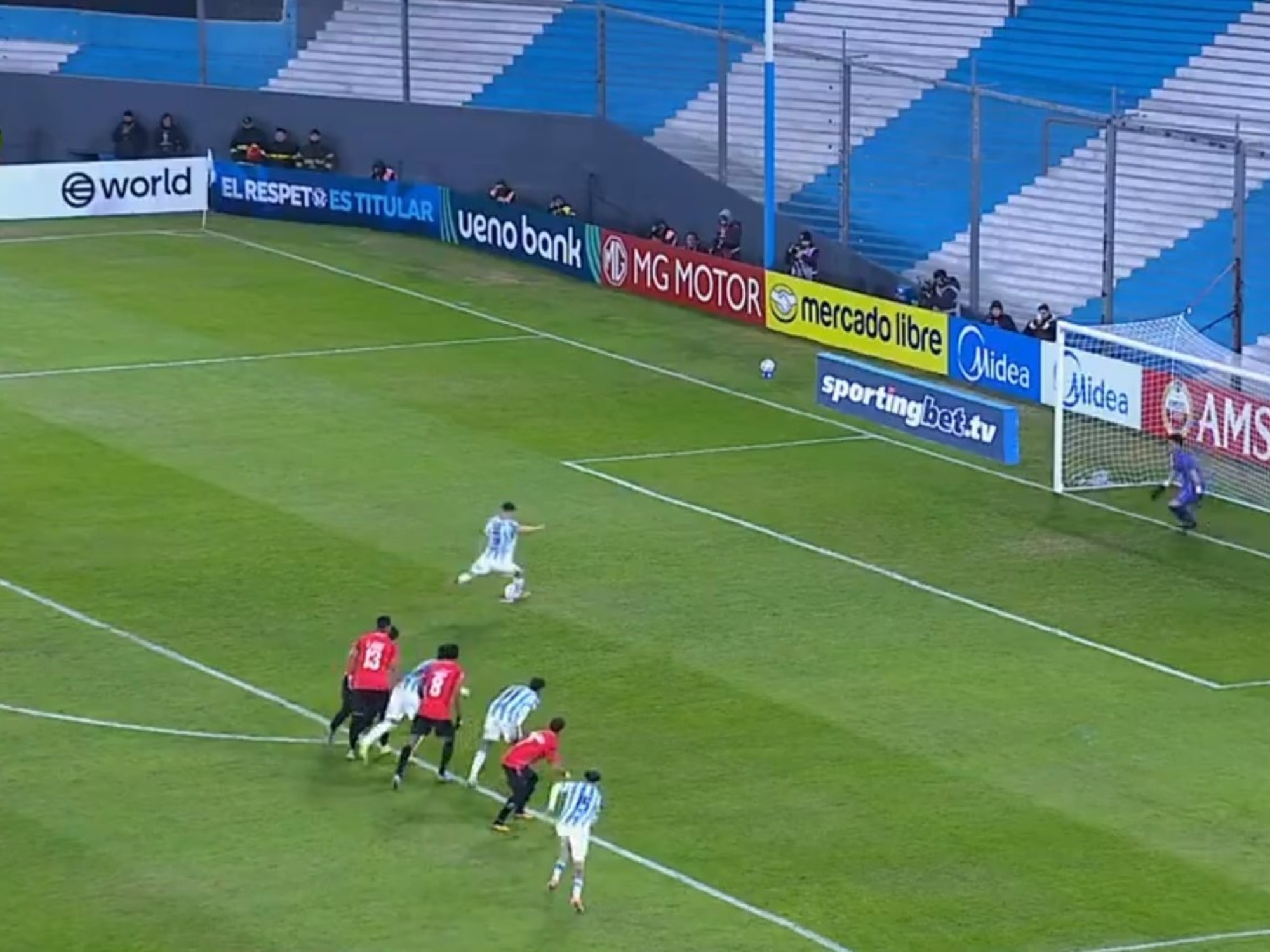 Adrián Martínez, forward for Racing Club, celebrating a goal.