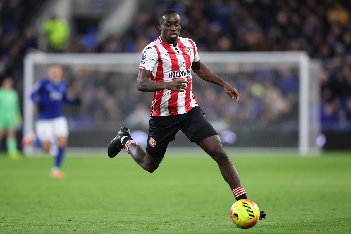 Michael Kayode of Brentford and Giorgio Scalvini of Atalanta in separate match action photos