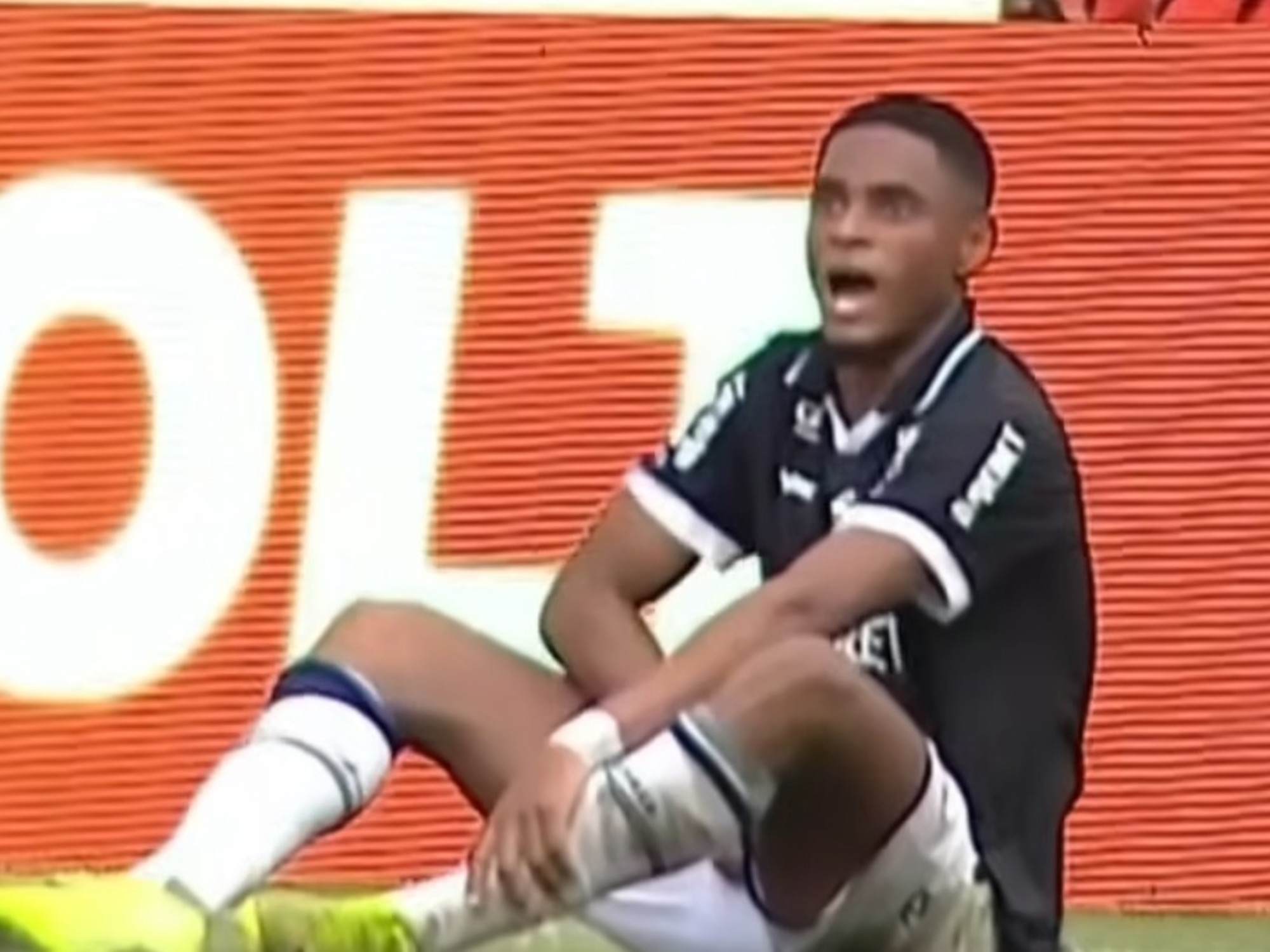 Football player on the pitch during a professional match.