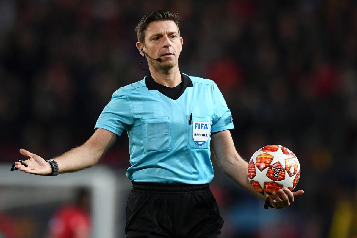 Referee Gianluca Rocchi reacts during a UEFA Champions League match between Manchester United and FC Barcelona in 2019.