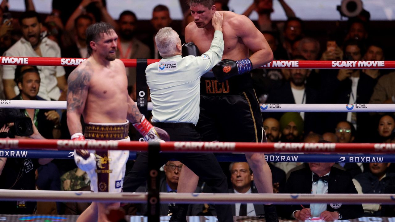Usyk Retains Heavyweight Titles After Controversial Technical Knockout in Egypt