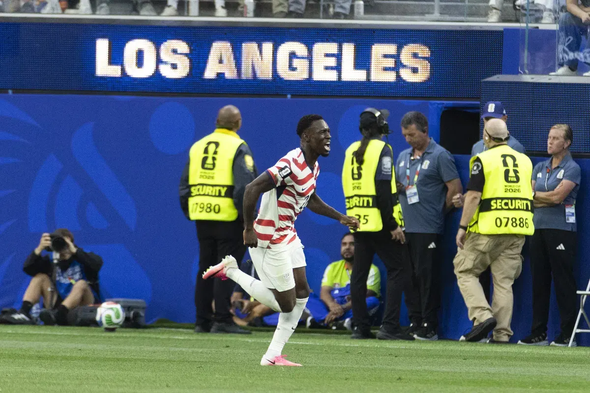 US Men's National Team players celebrating a goal during their World Cup match against Paraguay.