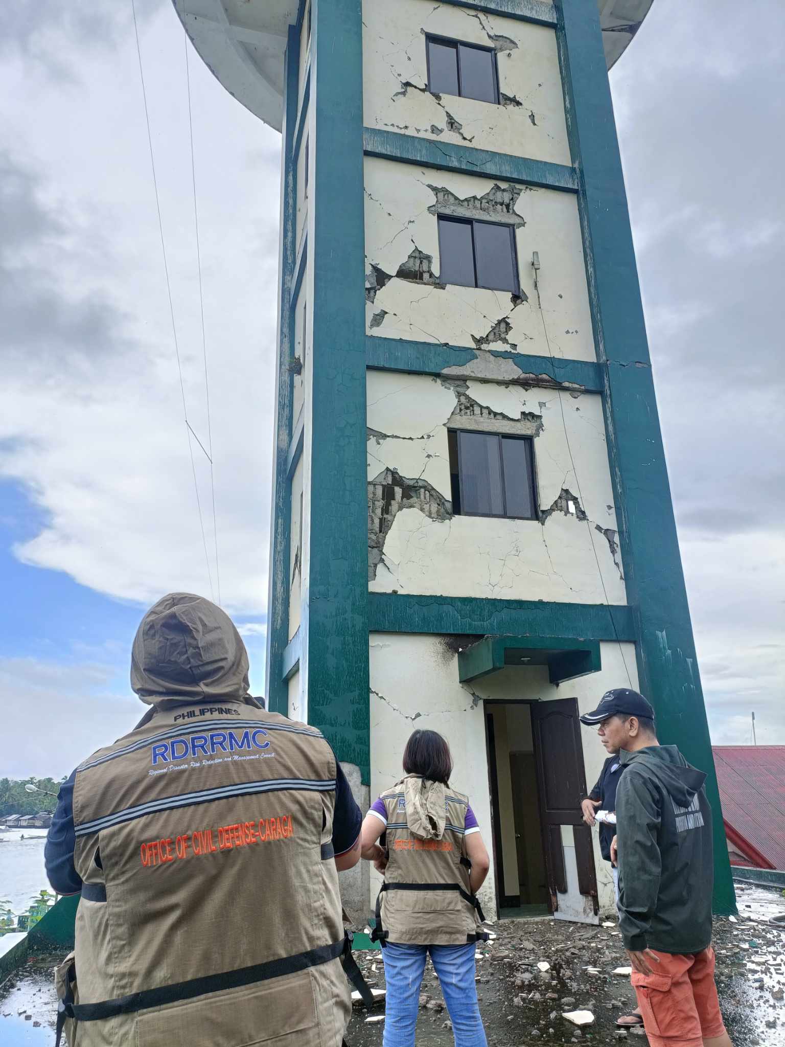 Damaged buildings and debris in a Philippine city after a major earthquake.