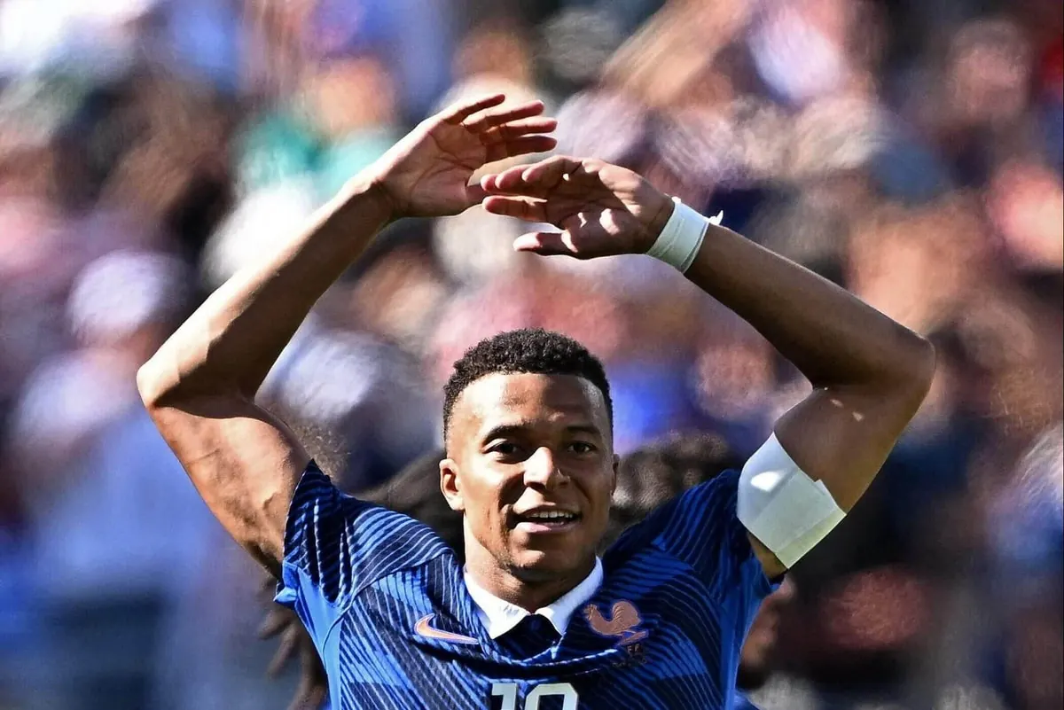 Kylian Mbappe celebrates scoring a goal for France during a World Cup match.