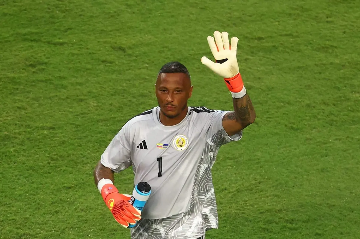 Eloy Room dives to make a save during the World Cup match between Curacao and Ecuador.