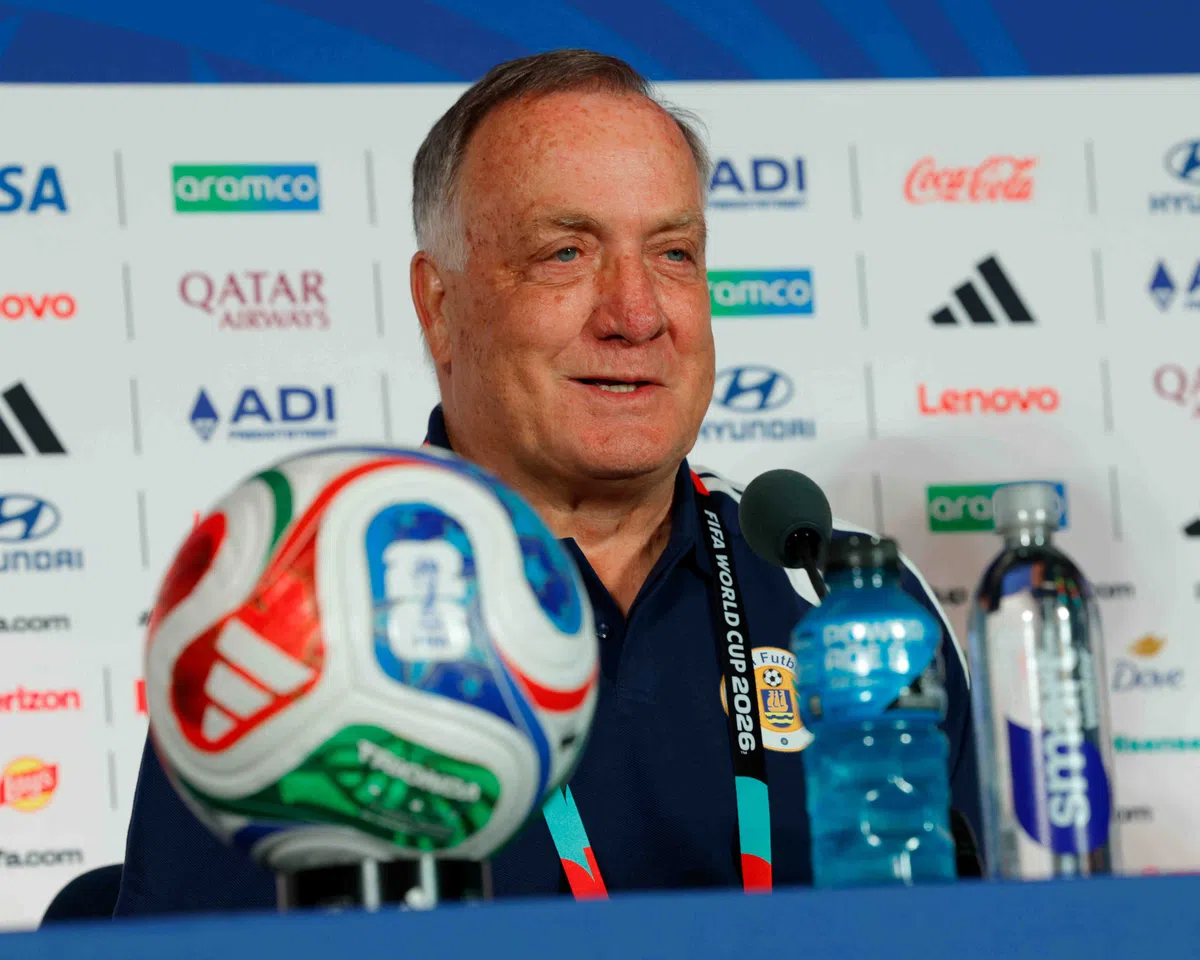 Dick Advocaat, head coach of the Curaçao national football team, gestures during a press conference.