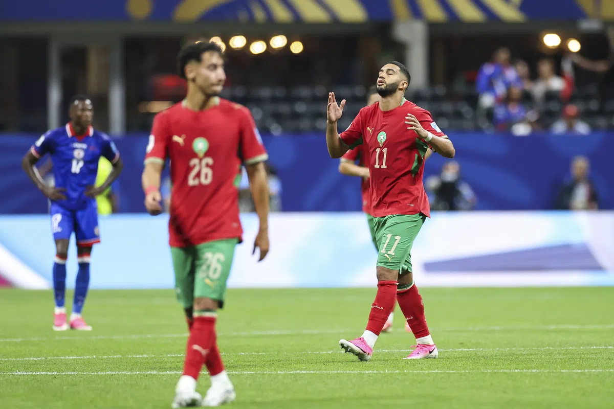 Ismael Saibari and Anass Salah-Eddine celebrating a goal for Morocco during a World Cup match.