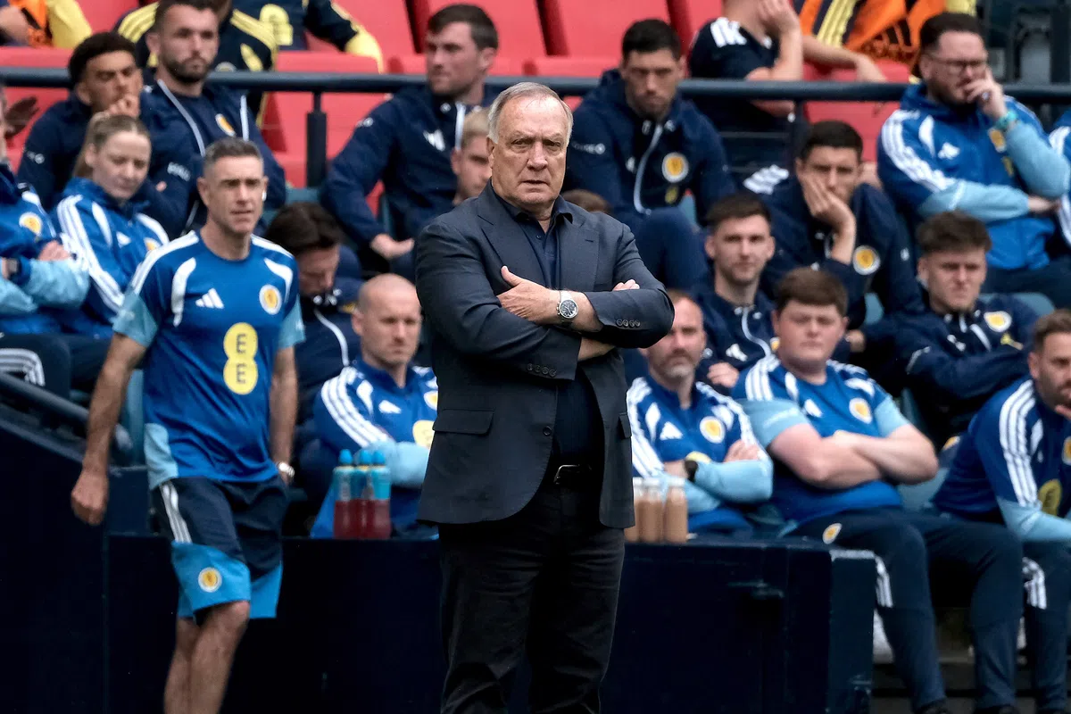 Dick Advocaat gestures while coaching the Curaçao national football team.