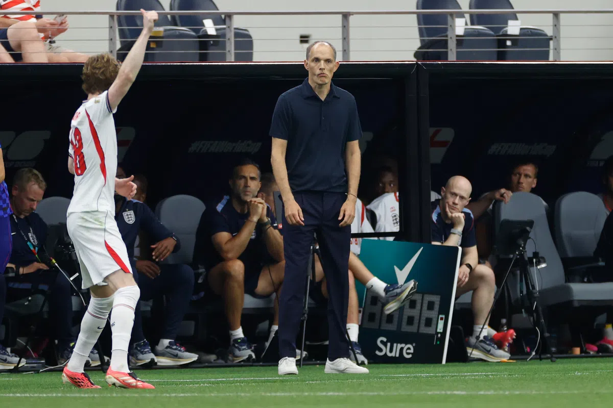 England players celebrating a goal on the pitch