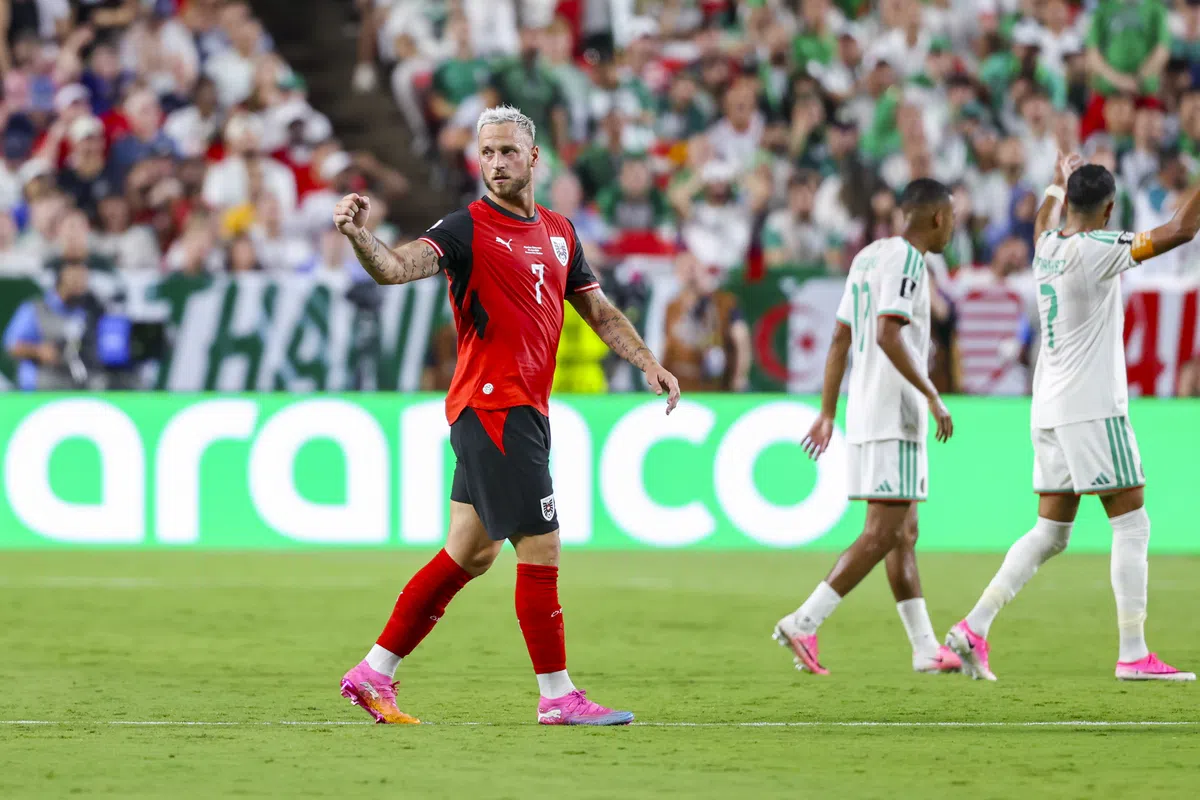 Football players in action on a World Cup pitch
