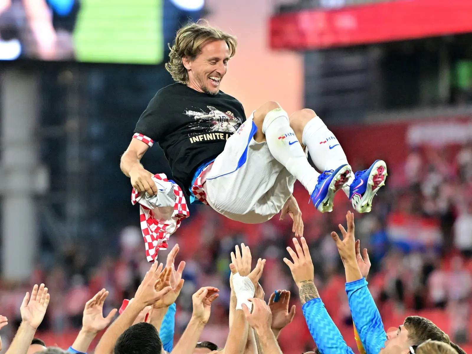 Luka Modrić celebrates with his Croatia teammates after reaching 200 international caps.