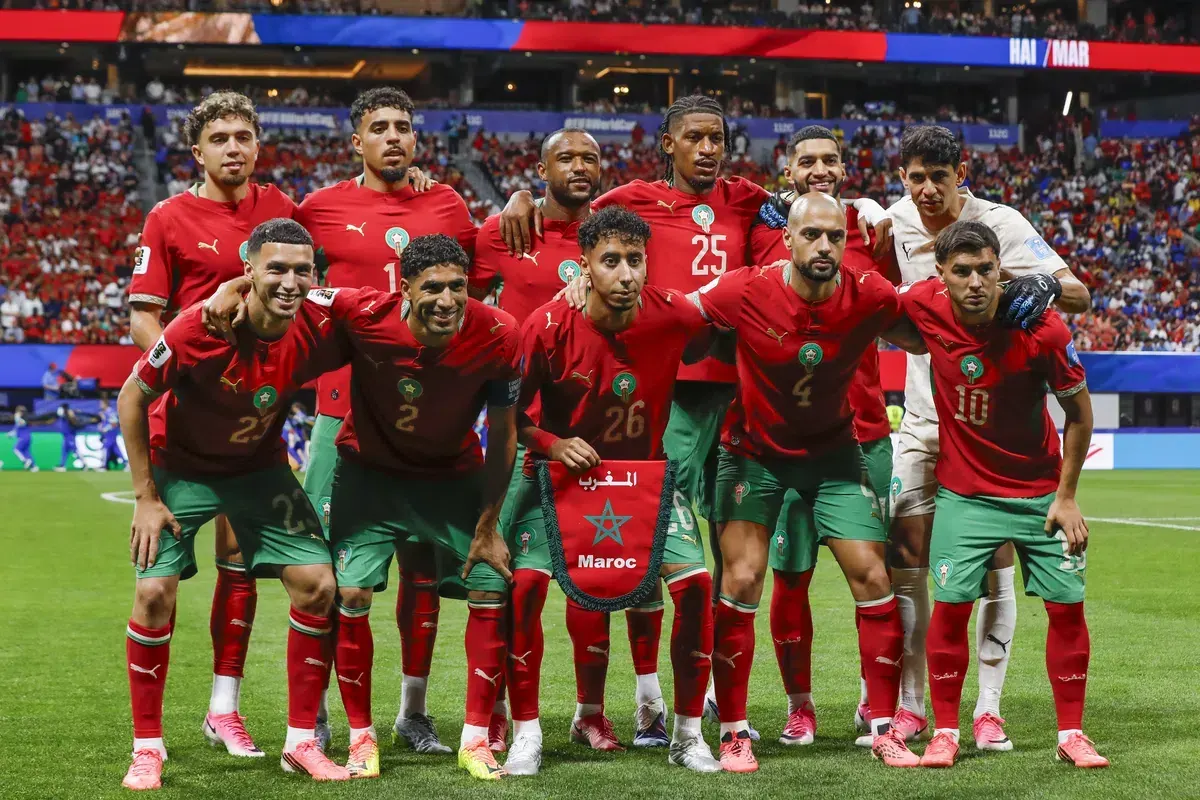 Members of the Morocco national football team celebrating a goal during a World Cup match.