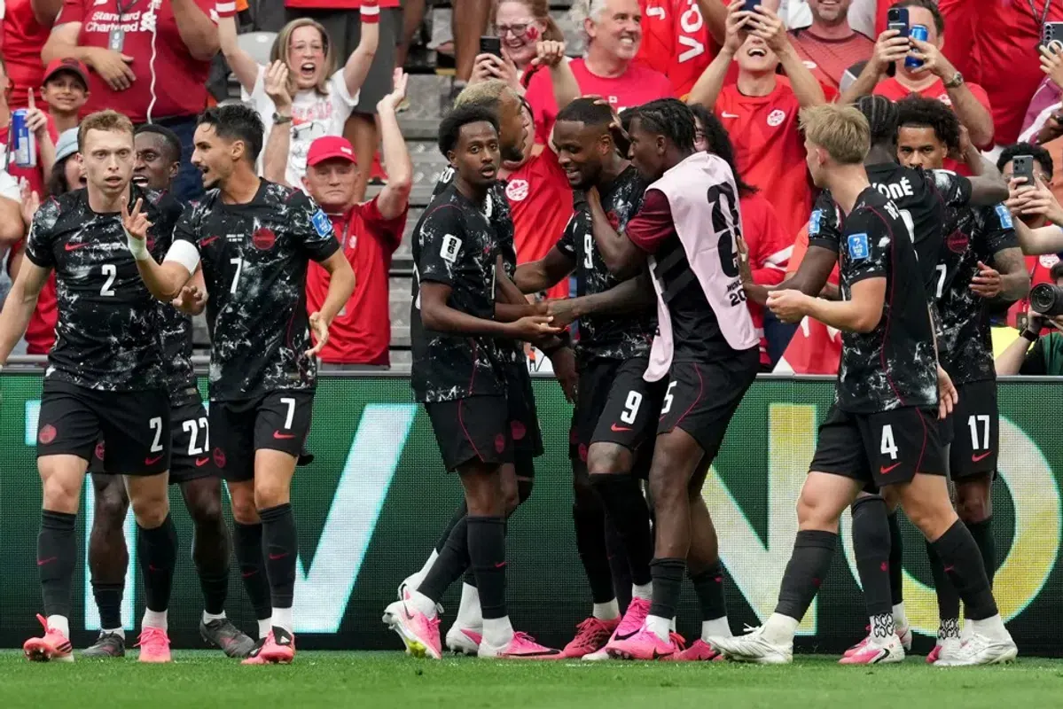 Cyle Larin celebrating a goal for Canada at the World Cup
