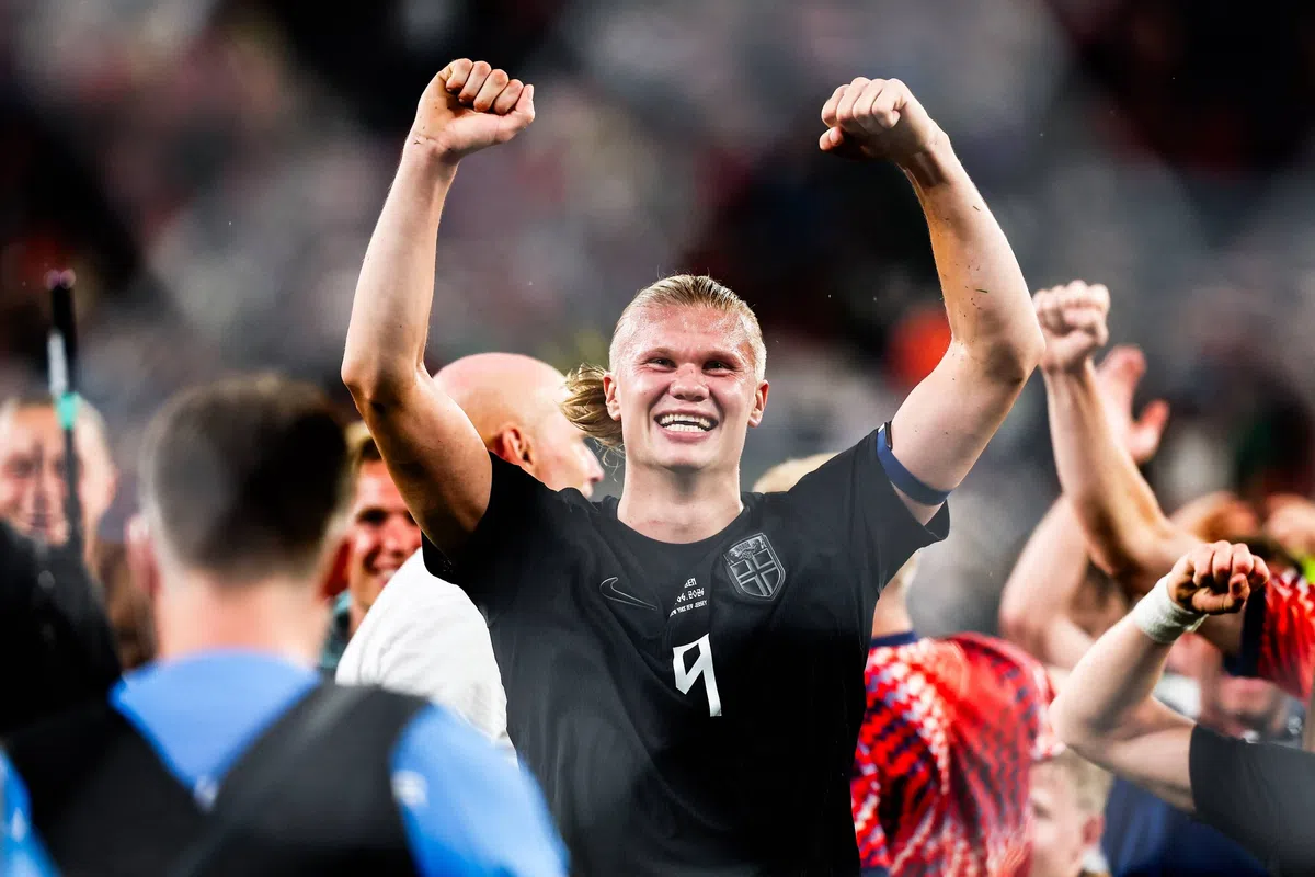 Erling Haaland in action for Norway during a World Cup match, celebrating a goal.