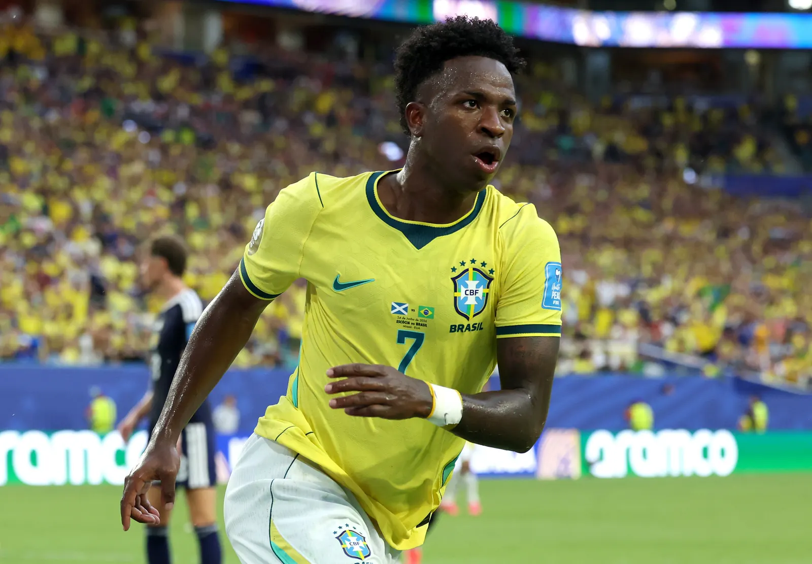 Vinícius Júnior celebrating after scoring a goal for Brazil.