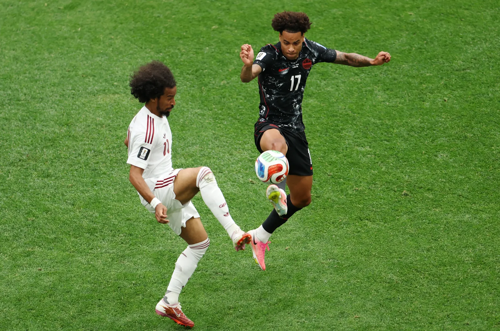 Canadian players celebrating a goal during their FIFA World Cup match against Qatar.