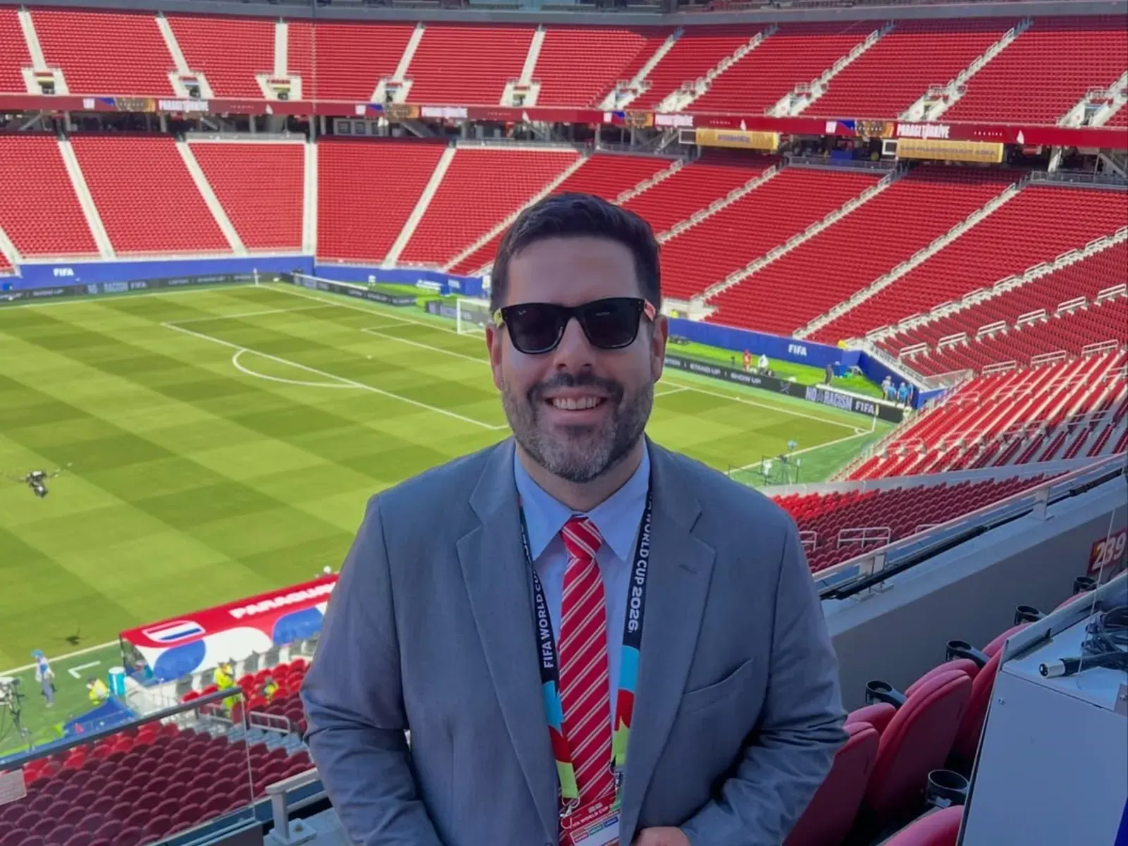 FIFA World Cup trophy displayed at a stadium event.