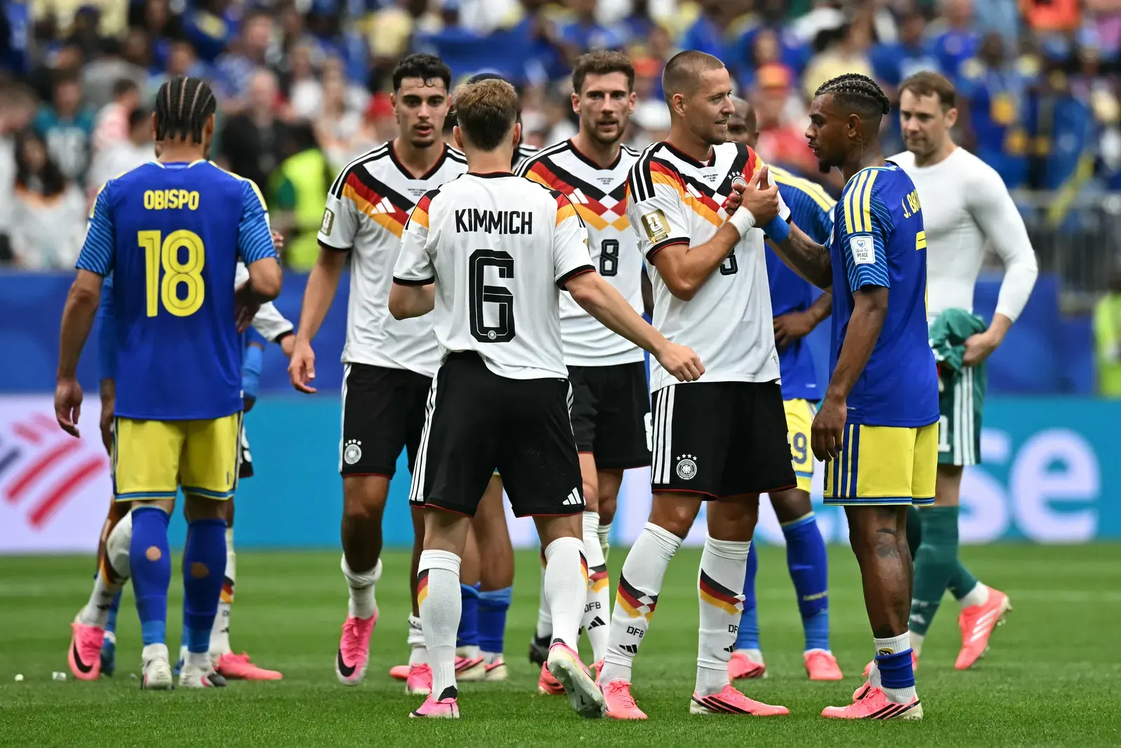 Germany national football team players celebrating a goal during a match.