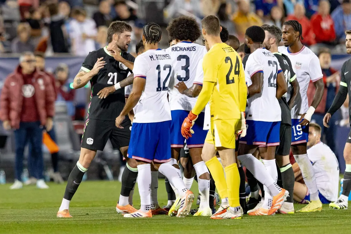 USMNT players in action during a football match against Australia.