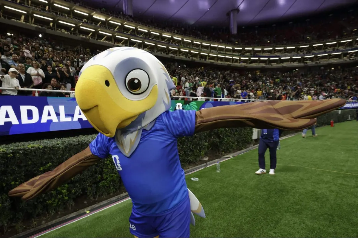 Clutch the Bald Eagle, the mascot for the FIFA World Cup 2026, stands on a football pitch.