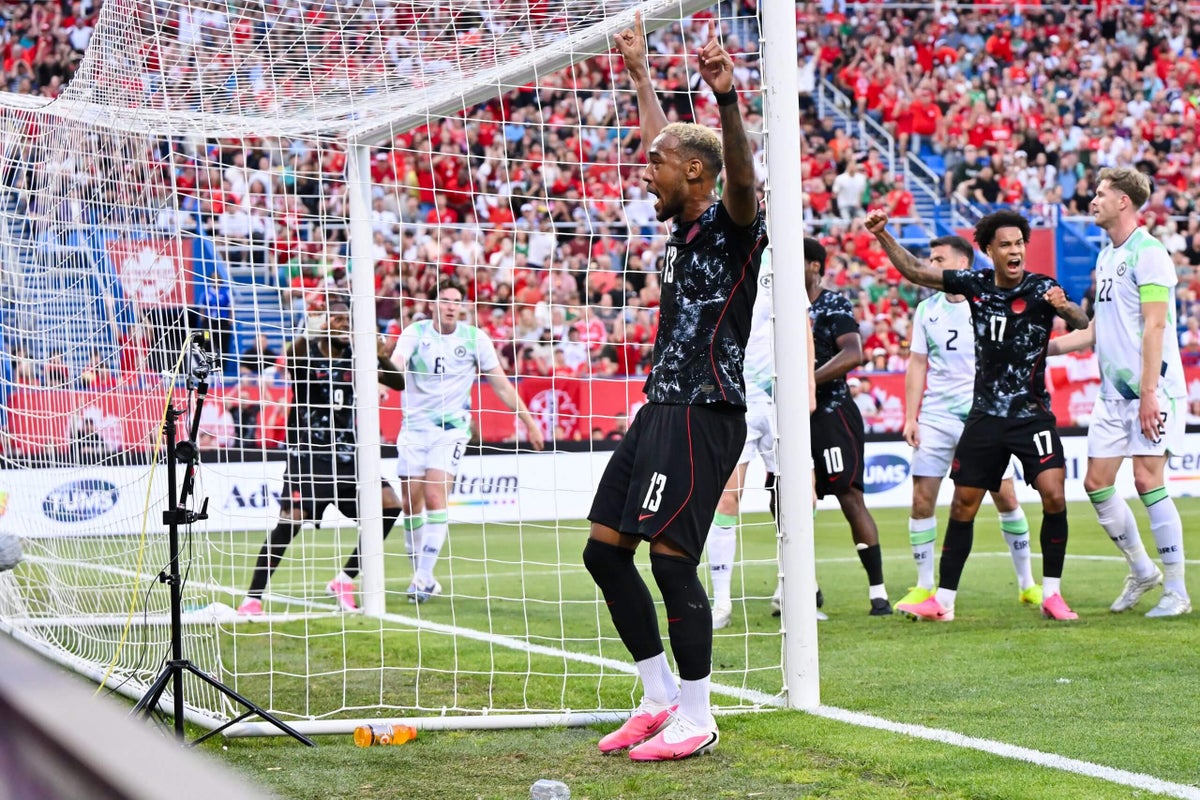 Canada national football team players celebrating on the pitch