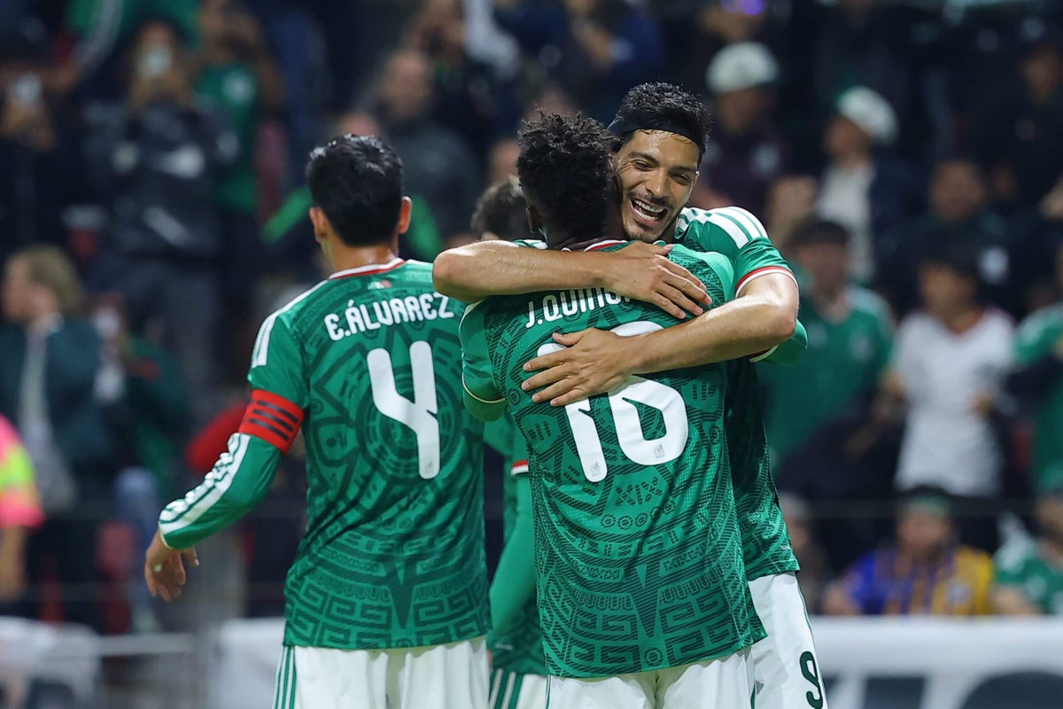 Fans celebrate as Mexico's Julián Quiñones scores the opening goal of the 2026 World Cup.