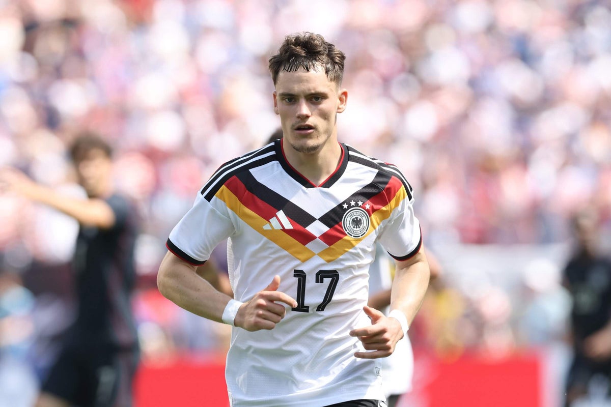 Florian Wirtz of Germany in a competitive match, focusing on his presence on the field during a game.