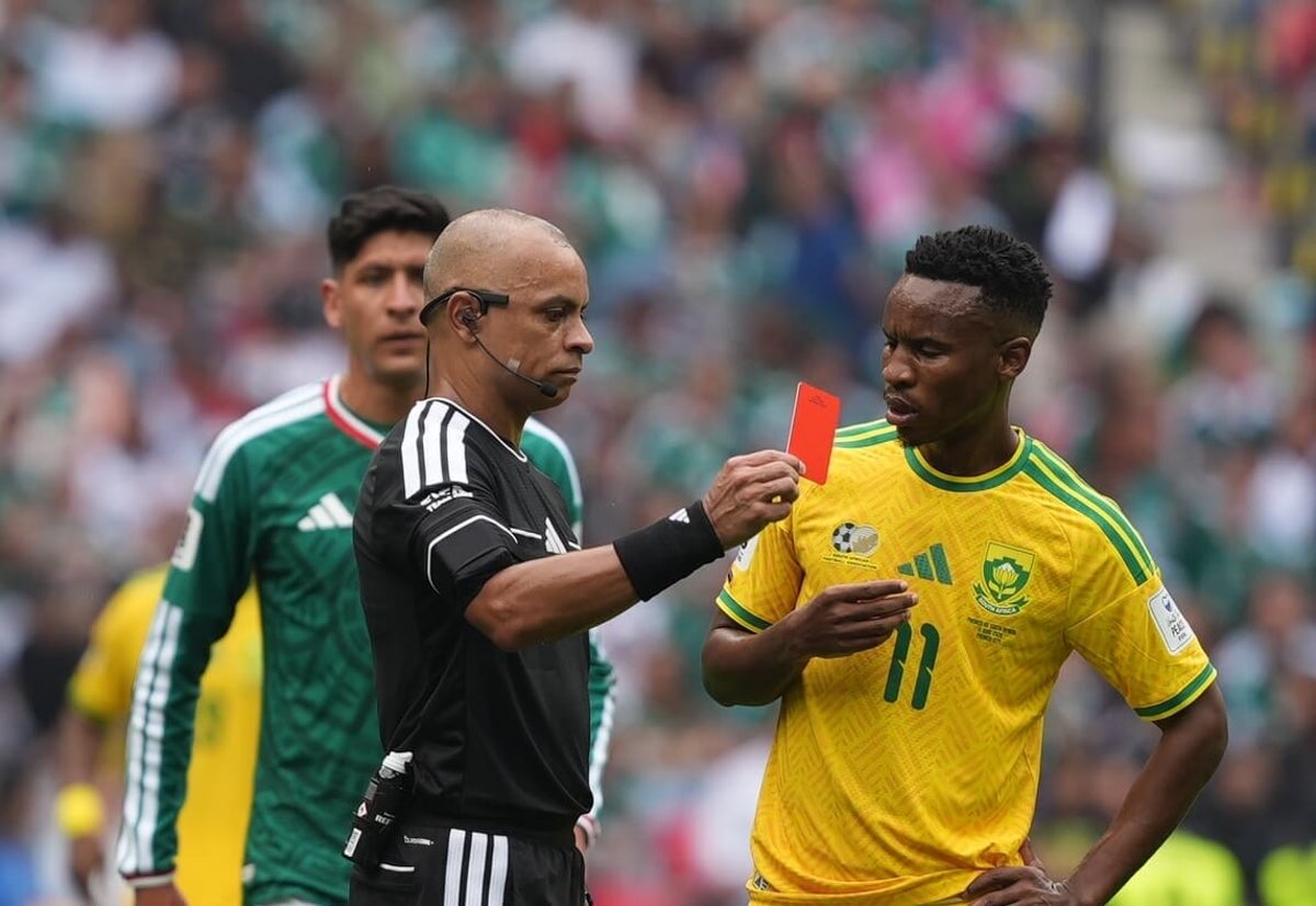 Referee Wilton Sampaio shows a red card during the World Cup match between Mexico and South Africa.