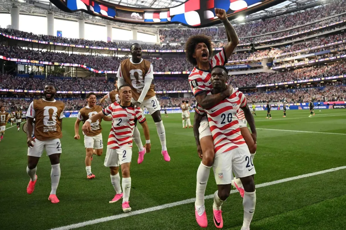 USMNT players celebrating a goal during their World Cup 2026 opening match against Paraguay.