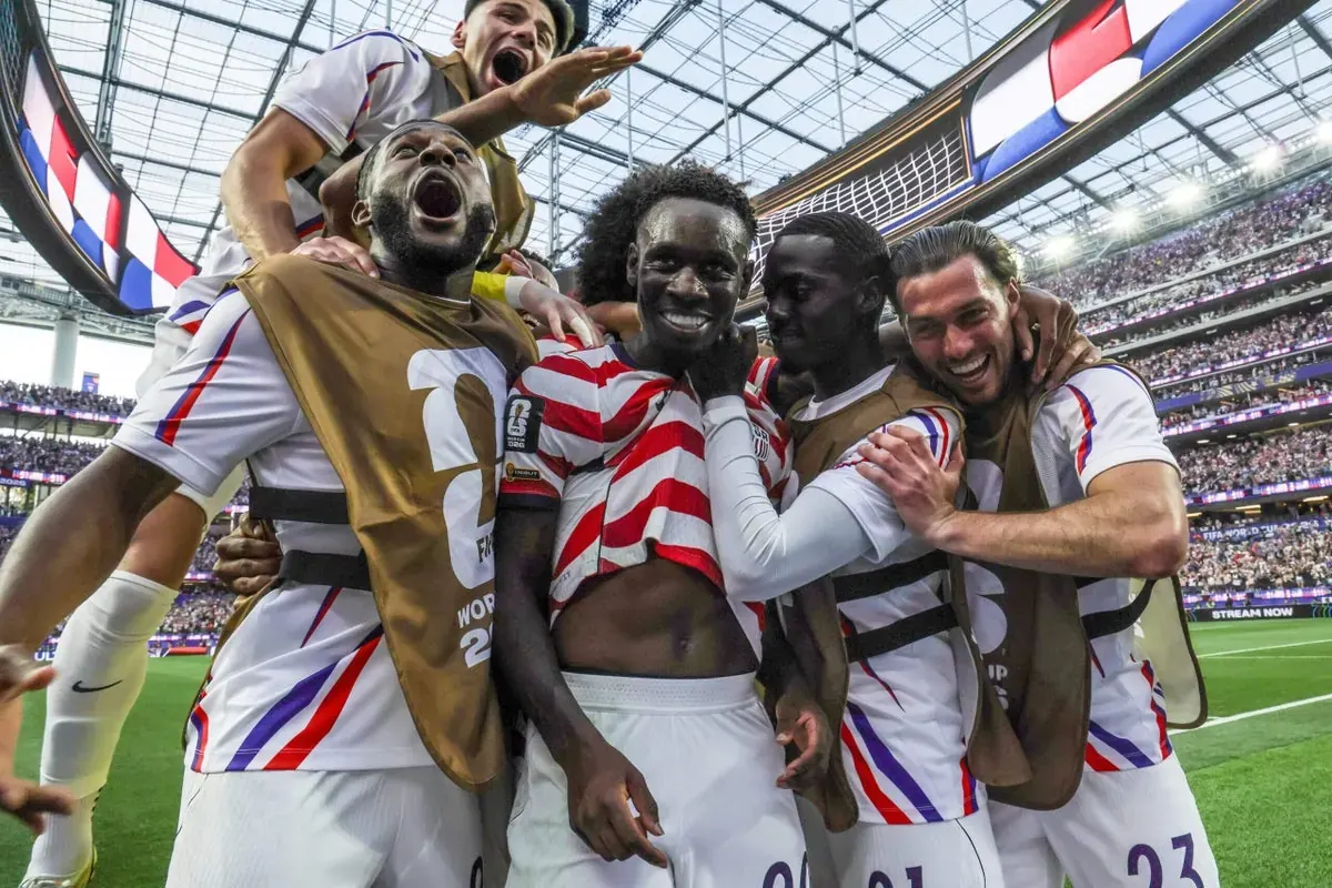 Football players competing during a 2026 FIFA World Cup match.