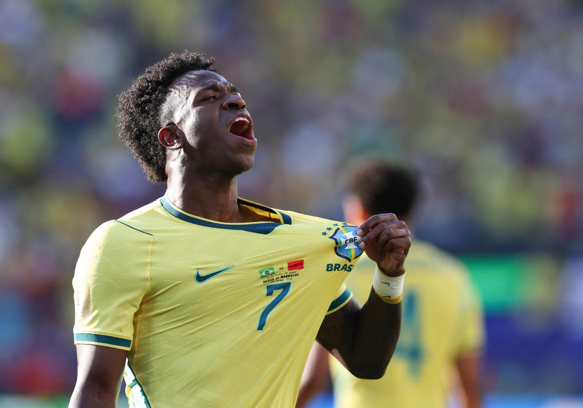 Vinícius Júnior celebrating after scoring for Brazil.