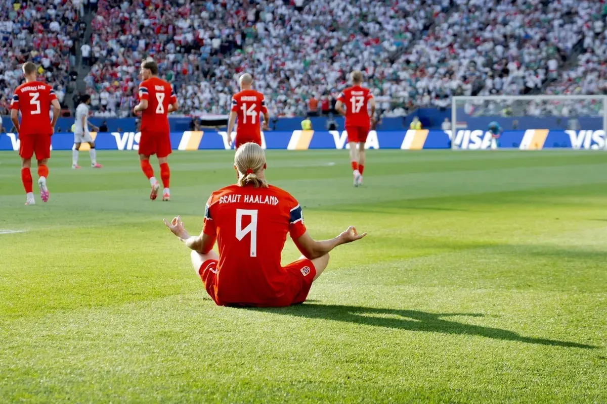 Erling Haaland celebrates scoring a goal during his World Cup debut match.