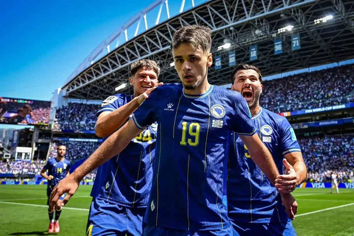 Kerim Alajbegovic, the young Bosnian forward, celebrates a goal during a FIFA World Cup match.