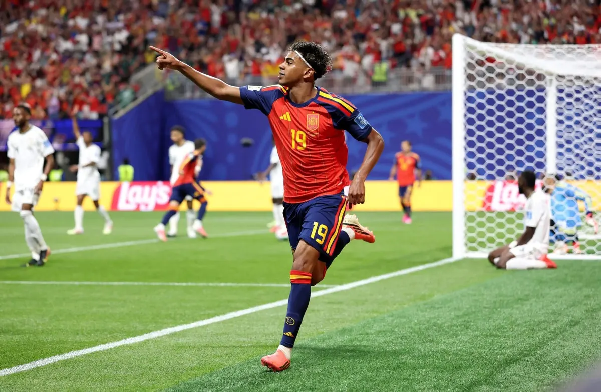 Lamine Yamal of Spain celebrates scoring a goal during a World Cup match.