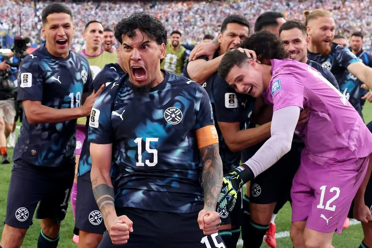 Paraguay players celebrate a dramatic World Cup victory over Germany.
